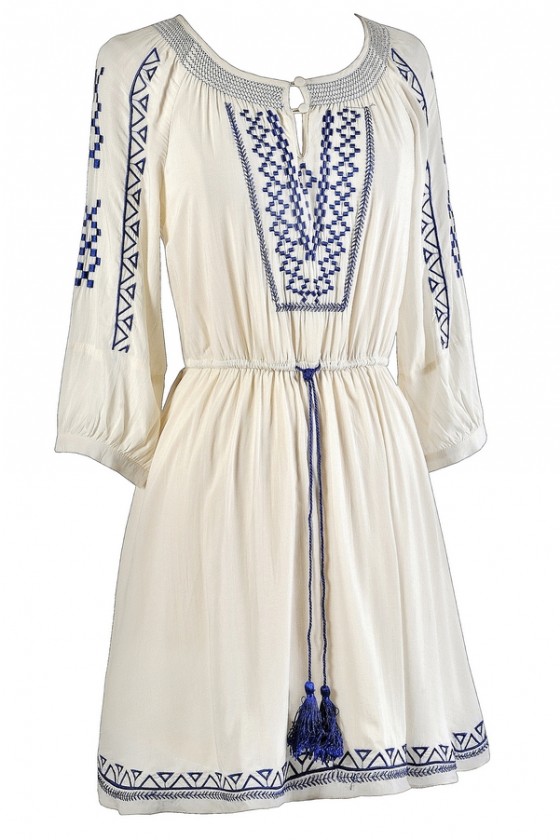 white dress with blue embroidery
