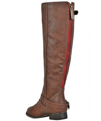 tan boots with red zipper